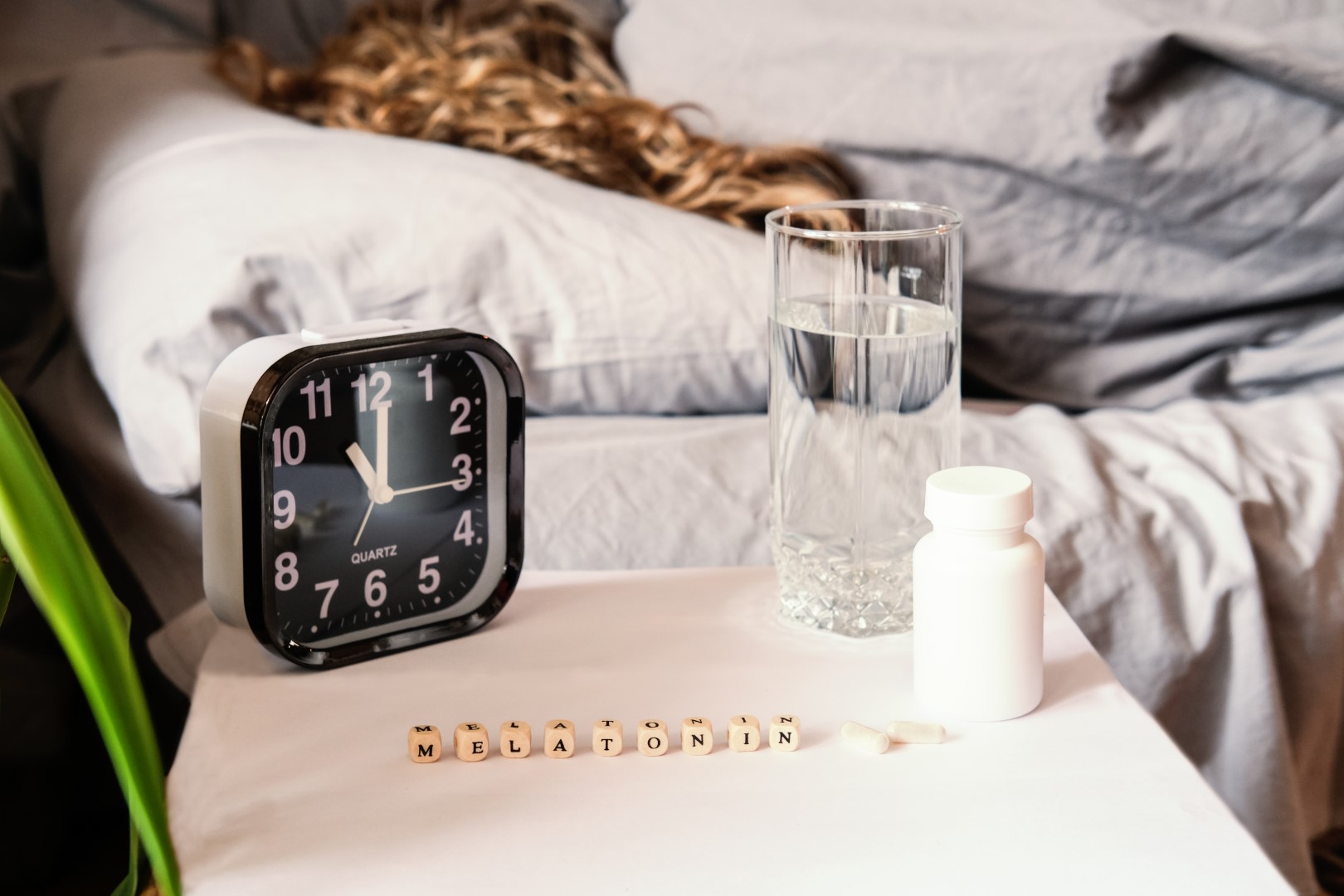 beautiful-curly-haired-woman-laying-in-bed-health-2023-11-27-05-17-45-utc (Large)